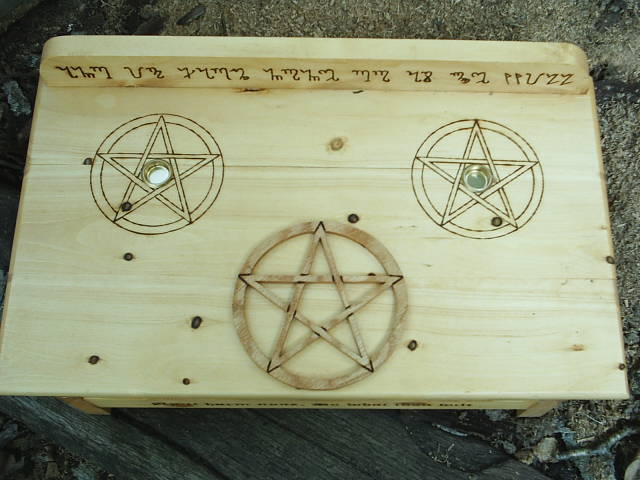 Three Pentacles and symbols for the god and goddess on this Wiccan Altar