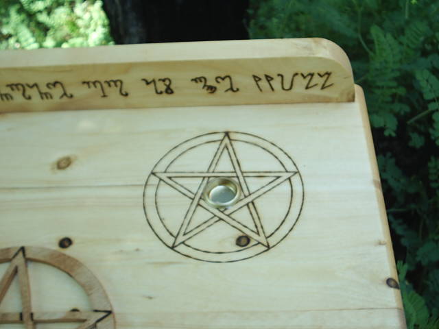Two pentacles with candle holders included on the top of this wiccan altar